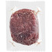 Rastelli's 6 oz. Antibiotic-Free Filet Mignon in plastic wrapper on white surface.