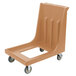A beige plastic Cambro dolly with wheels for 1826MTC Camcarriers.