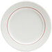 A white Tuxton china plate with red lines on the rim.