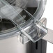 A close-up of a Robot Coupe stainless steel bowl assembly in a food processor.