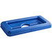 A blue plastic Toter lid with a hole.