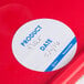 A red plastic dispenser carton of Noble Products round removable labels with a white circle and blue text.