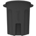 A black plastic Toter round trash can with a lid on top.