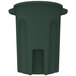 A green plastic Toter round trash can with a lid.