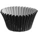 A black foil cupcake wrapper with a black and white pattern.