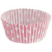 A pink Enjay cupcake wrapper with white dots.
