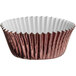 A close up of a brown and white Enjay foil baking cup.