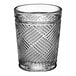 A clear Acopa Zion shot glass with a pattern on it.