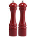 Two Chef Specialties red pepper mills with white tops.