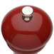 A Chef Specialties Autumn Hues candy apple red pepper mill with a silver top.