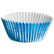 A close up of a blue paper Enjay cupcake liner with a white rim.