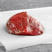 A piece of Shaffer Venison Farms boneless venison loin steak on white paper.