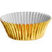 A white and gold Enjay gold foil baking cup.