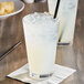 A glass of Jones Left Coast Lemonade with a straw on a napkin.