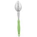 A Vollrath Jacob's Pride perforated basting spoon with a green Ergo grip handle.