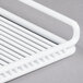 A close-up of a white coated wire shelf.