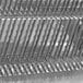 A close-up of the Estella Countertop Bread Slicer's metal grate.