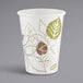 A white Dixie paper hot cup with brown and green leaves on it.