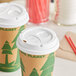 A stack of white Dixie paper cup lids.