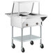 A ServIt stainless steel commercial electric steam table with sneeze guard and casters.