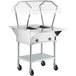 A silver ServIt electric steam table on wheels with a clear cover.