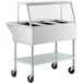 A ServIt stainless steel hot food warmer cart with three open wells and an angled glass sneeze guard.