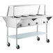 A ServIt open well stainless steel electric steam table on wheels.