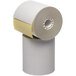 A roll of white Point Plus carbonless cash register paper with a yellow strip.