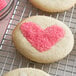 Heart-shaped cookies with pink Regal sanding sugar on top.