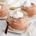 A glass cup filled with chocolate dessert made with Cacao Barry Grand Caraque Cocoa Mass.