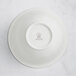 A white RAK Porcelain salad bowl with an embossed crown.