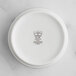 A white RAK Porcelain cigar ashtray with an embossed crown logo.