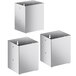 A white stainless steel organizer with three square sections and holes in the bottom of each.