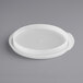 A white plastic round food storage container lid.