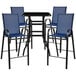 A Flash Furniture outdoor patio bar table with navy chairs on a black metal table.