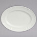 A white oval Tuxton china platter with a swirl design.