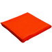 An orange Intedge cloth table cover folded on a white background.