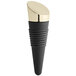 A black rubber Franmara bottle stopper with a gold-plated top.