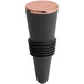 A black and copper Franmara bottle stopper with a rose gold rim in a wine container.