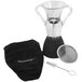 A clear glass pitcher with two handles and a black and silver Decantus wine aerator cup with a straw and spoon inside.