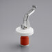 A white and red Franmara Italia wine bottle stopper with a metal lever.