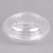 A Dart clear plastic bowl with a dome lid on a white surface.