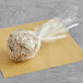 A Chalet Desserts Cookies and Cream cake pop in plastic packaging.