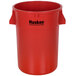 A red plastic trash can with black "Huskee" text.