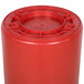 A red Continental Huskee round trash can with a lid.