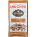 A brown and white Land O Lakes Cocoa Classics Mocha and Chocolate packet on a counter.