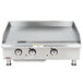 A stainless steel APW Wyott countertop griddle with three burners.