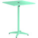A green Lancaster Table & Seating bar height table with a metal pole.