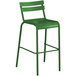 A green powder coated aluminum barstool with a back.