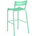 A sea foam green aluminum outdoor barstool with a backrest.